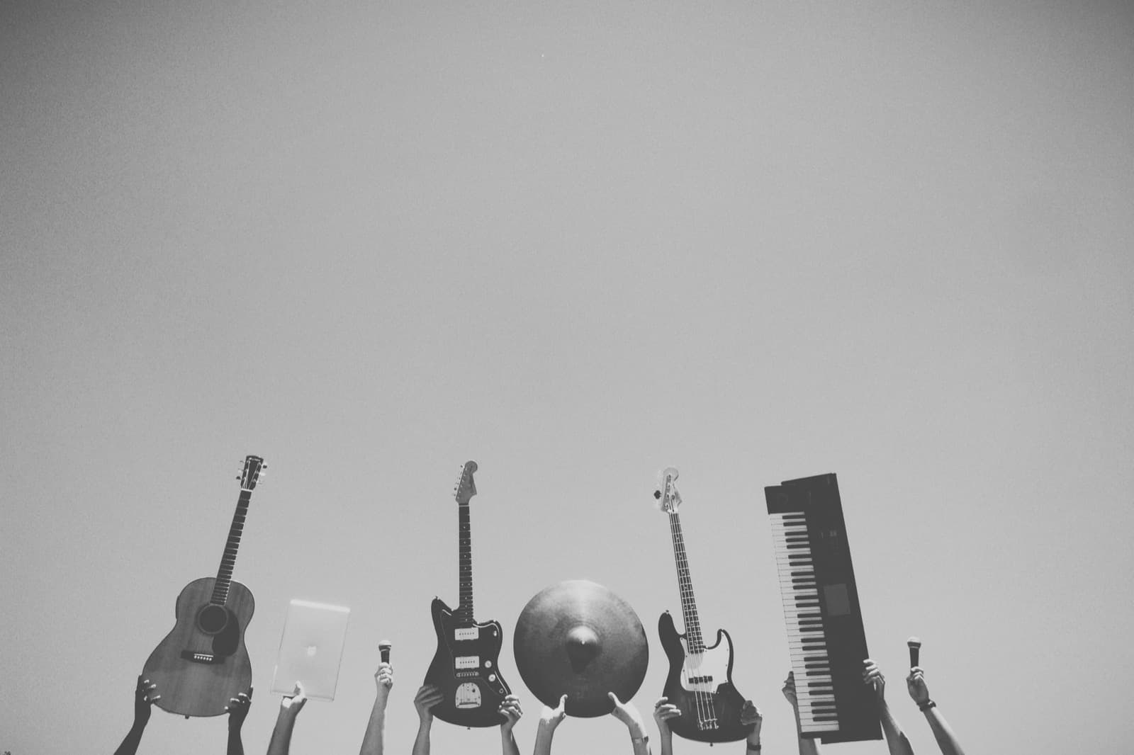Raised instruments against an open sky.